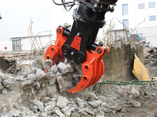 Demolition Grapple breaking concrete 