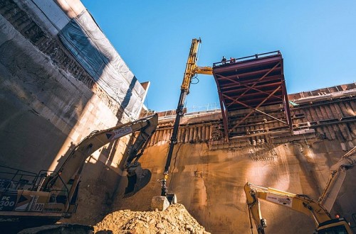 view of telidipper telescopic excavator attachment from bottom of deep pit